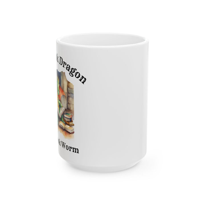 A white mug. Design on the mug reads "I'm a book dragon not a book worm." Between the text is a watercolor design of a dragon reading next to a stack of books.