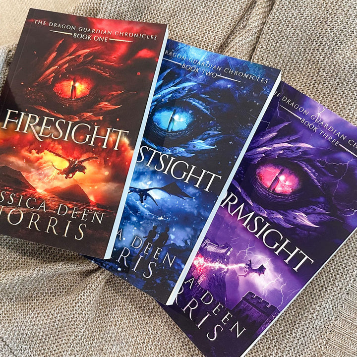 Firesight, Frostsight, and Stormsight paperbacks laid out next to each other