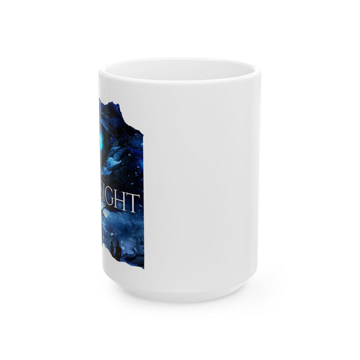 Side view of a white mug. Design on the mug is the cover of Frostsight, just showing the blue dragon eye and the title with the two main characters watching the dragon in the snowy mountain landscape.