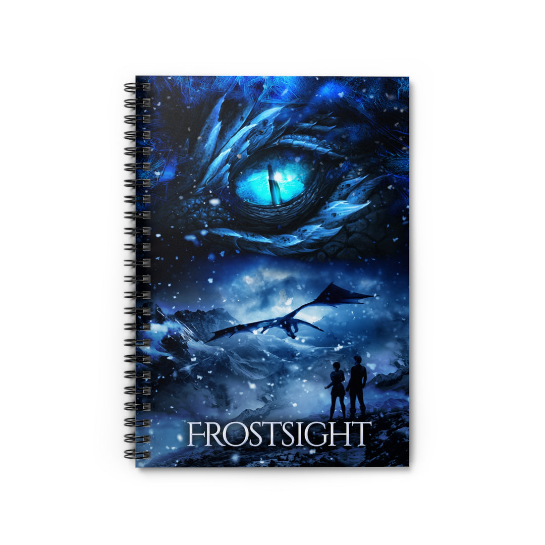 A notebook with a cover featuring the artwork from the cover of Frostsight. Artwork features a blue dragon eye at the top. Below the eye, the two main characters watch a dragon in the distance in a snowy mountain landscape. The title is at the bottom of the notebook cover.