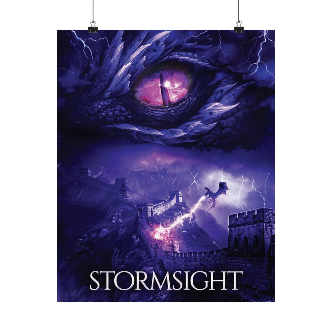 A poster featuring the artwork from the cover of Stormsight. Artwork features a purple dragon eye at the top. Below the eye, a dragon breathes lightning onto a wall. The title is at the bottom of the notebook cover.