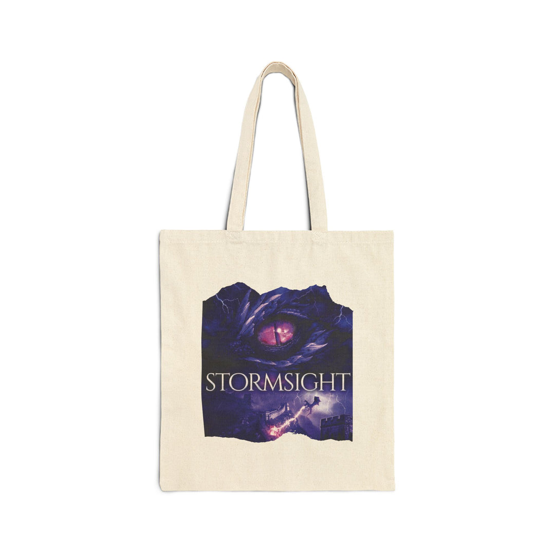 A tote bag. Design on the bag is the cover of Stormsight, just showing the purple dragon eye and the title with the a dragon breathing lightning onto a wall.