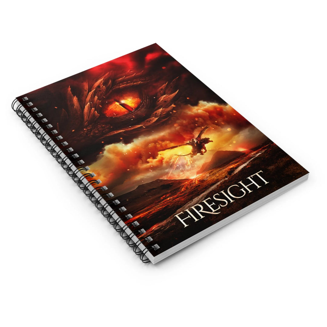 A notebook with the cover featuring the artwork from the cover of Firesight. Artwork features a red dragon eye at the top. Below the eye, the two main characters ride on a dragon over a volcano erupting. The title is at the bottom of the notebook cover.