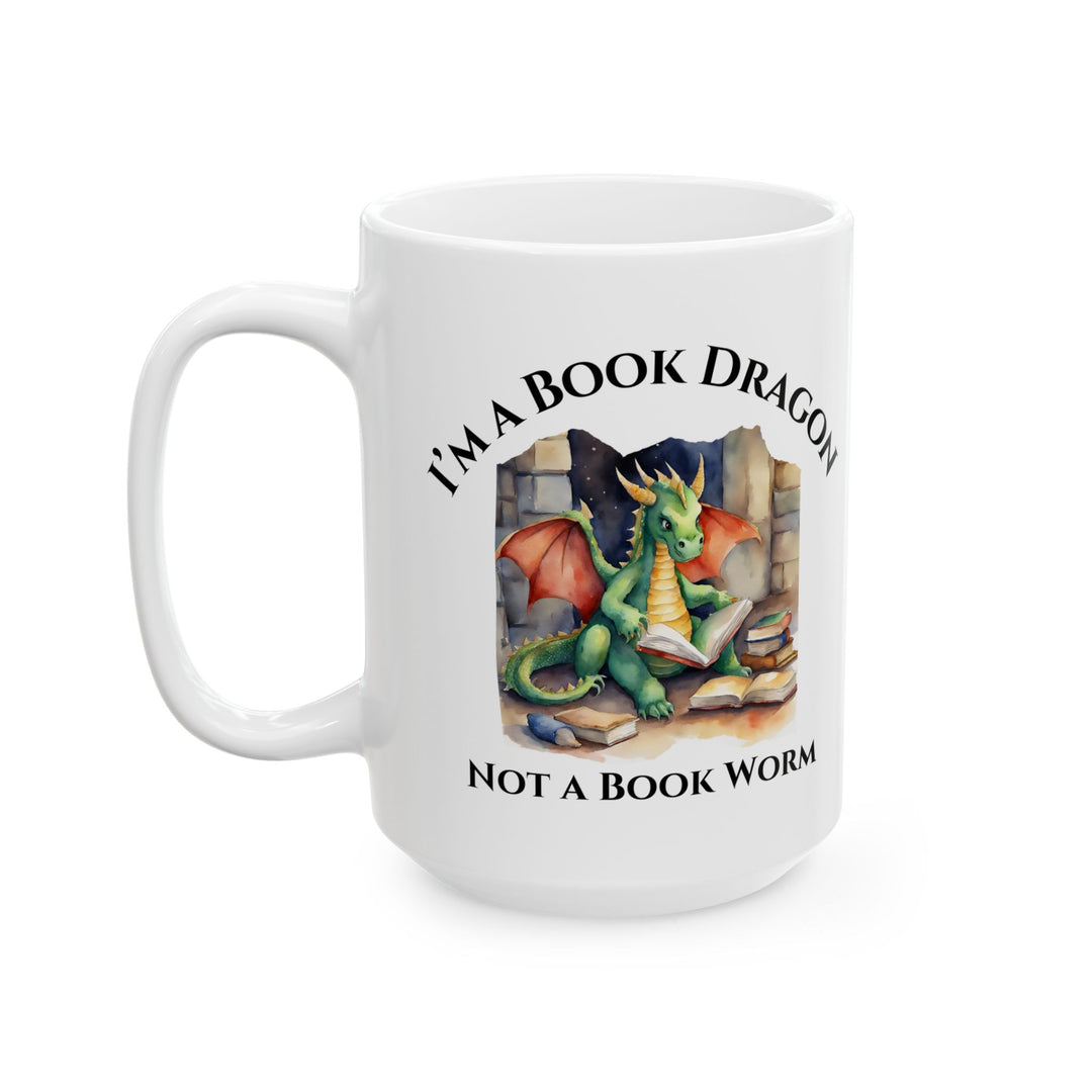 Front view of a white mug. Design on the mug reads "I'm a book dragon not a book worm." Between the text is a watercolor design of a dragon reading next to a stack of books.