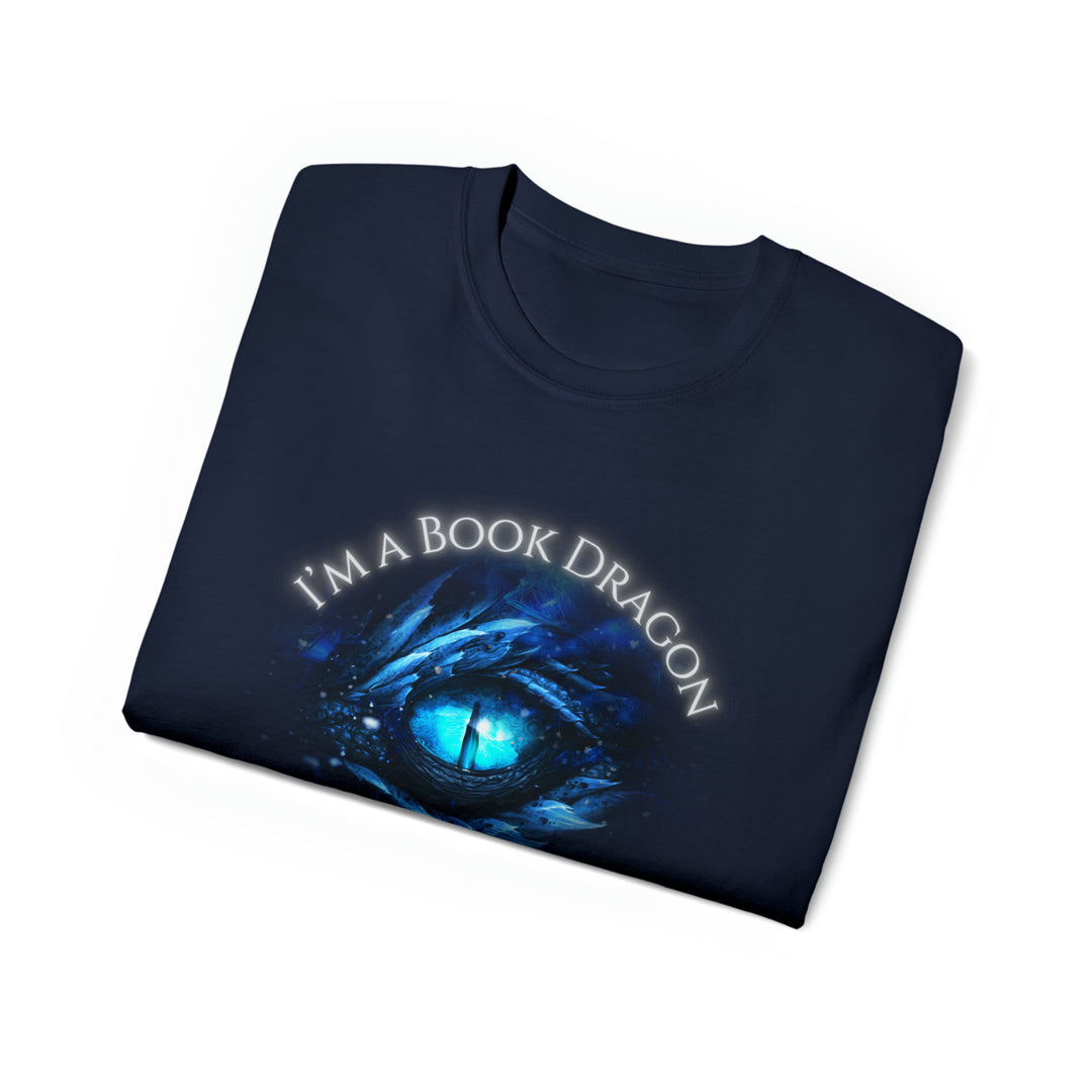 A folded navy t-shirt. Design on the shirt reads "I'm a book dragon not a book worm." Between the text is the blue dragon eye from the cover of Frostsight.