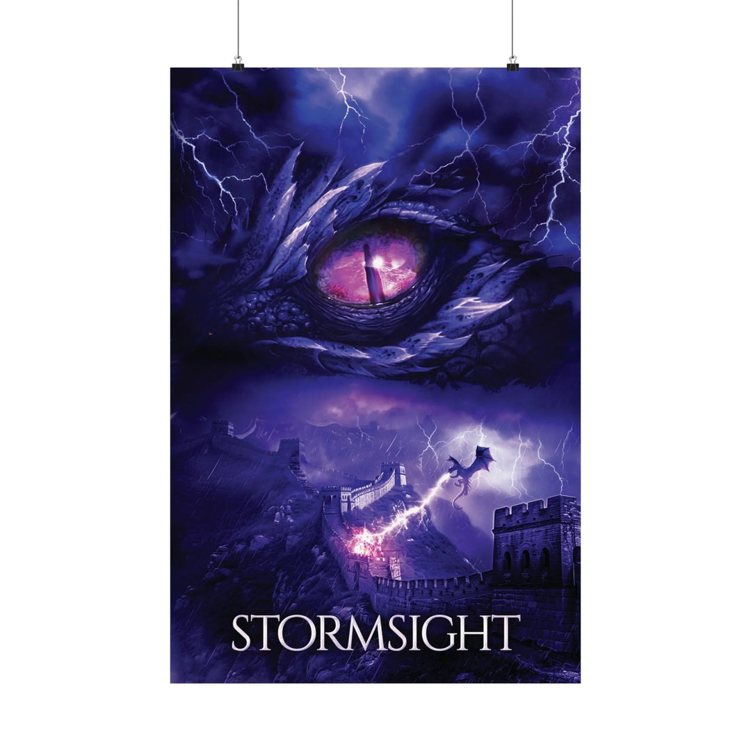 A poster featuring the artwork from the cover of Stormsight. Artwork features a purple dragon eye at the top. Below the eye, a dragon breathes lightning onto a wall. The title is at the bottom of the notebook cover.