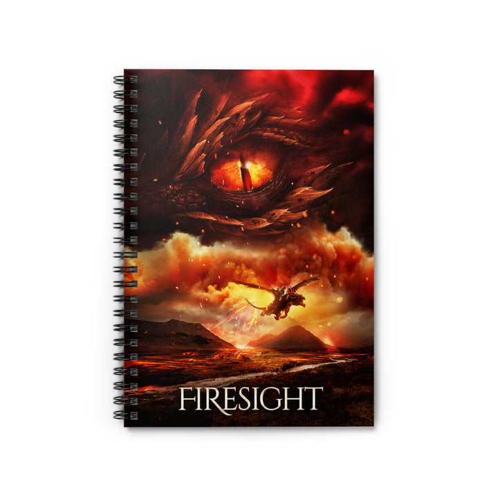 A notebook with the cover featuring the artwork from the cover of Firesight. Artwork features a red dragon eye at the top. Below the eye, the two main characters ride on a dragon over a volcano erupting. The title is at the bottom of the notebook cover.