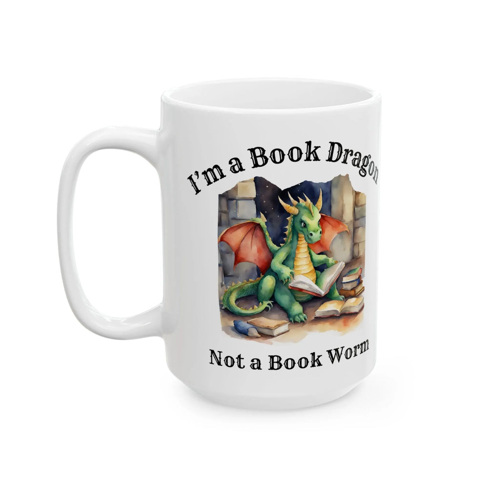 A white mug. Design on the mug reads "I'm a book dragon not a book worm." Between the text is a watercolor design of a dragon reading next to a stack of books.