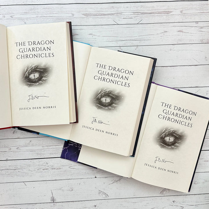 Firesight, Frostsight, and Stormsight hardcovers open to the title page with the author's signature