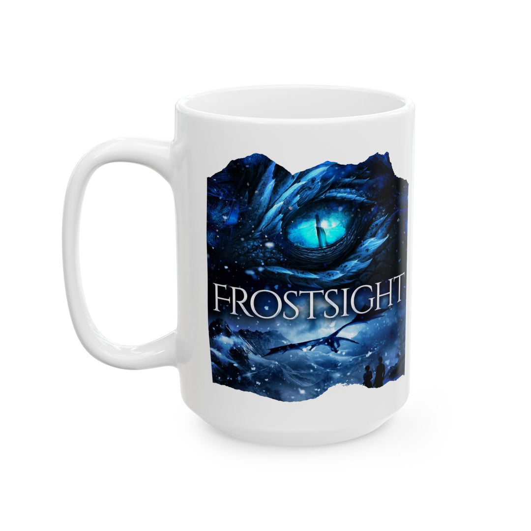 Front view of a white mug. Design on the mug is the cover of Frostsight, just showing the blue dragon eye and the title with the two main characters watching the dragon in the snowy mountain landscape.