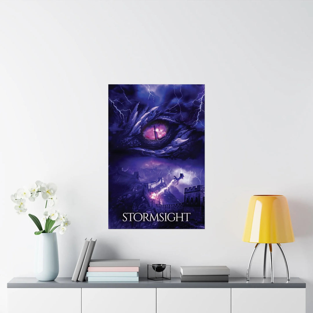 A poster featuring the artwork from the cover of Stormsight. Artwork features a purple dragon eye at the top. Below the eye, a dragon breathes lightning onto a wall. The title is at the bottom of the notebook cover.