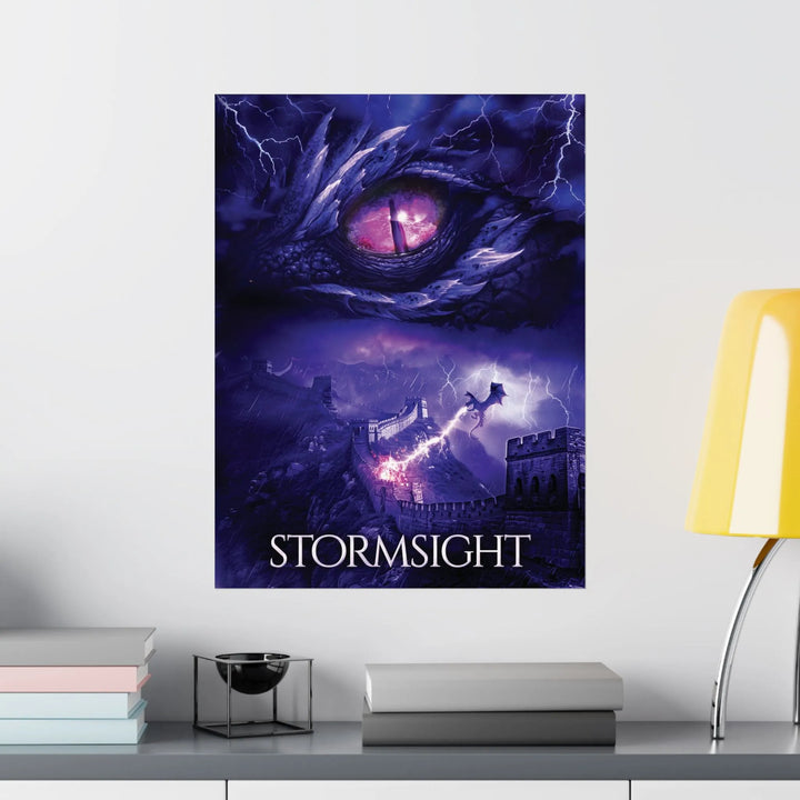 A poster featuring the artwork from the cover of Stormsight. Artwork features a purple dragon eye at the top. Below the eye, a dragon breathes lightning onto a wall. The title is at the bottom of the notebook cover.