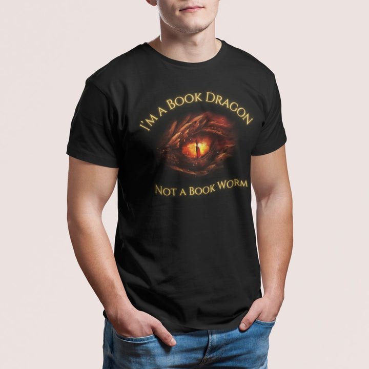 A man wearing a short sleeve black t-shirt. Design on the shirt reads "I'm a book dragon not a book worm." Between the text is the red dragon eye from the cover of Firesight.