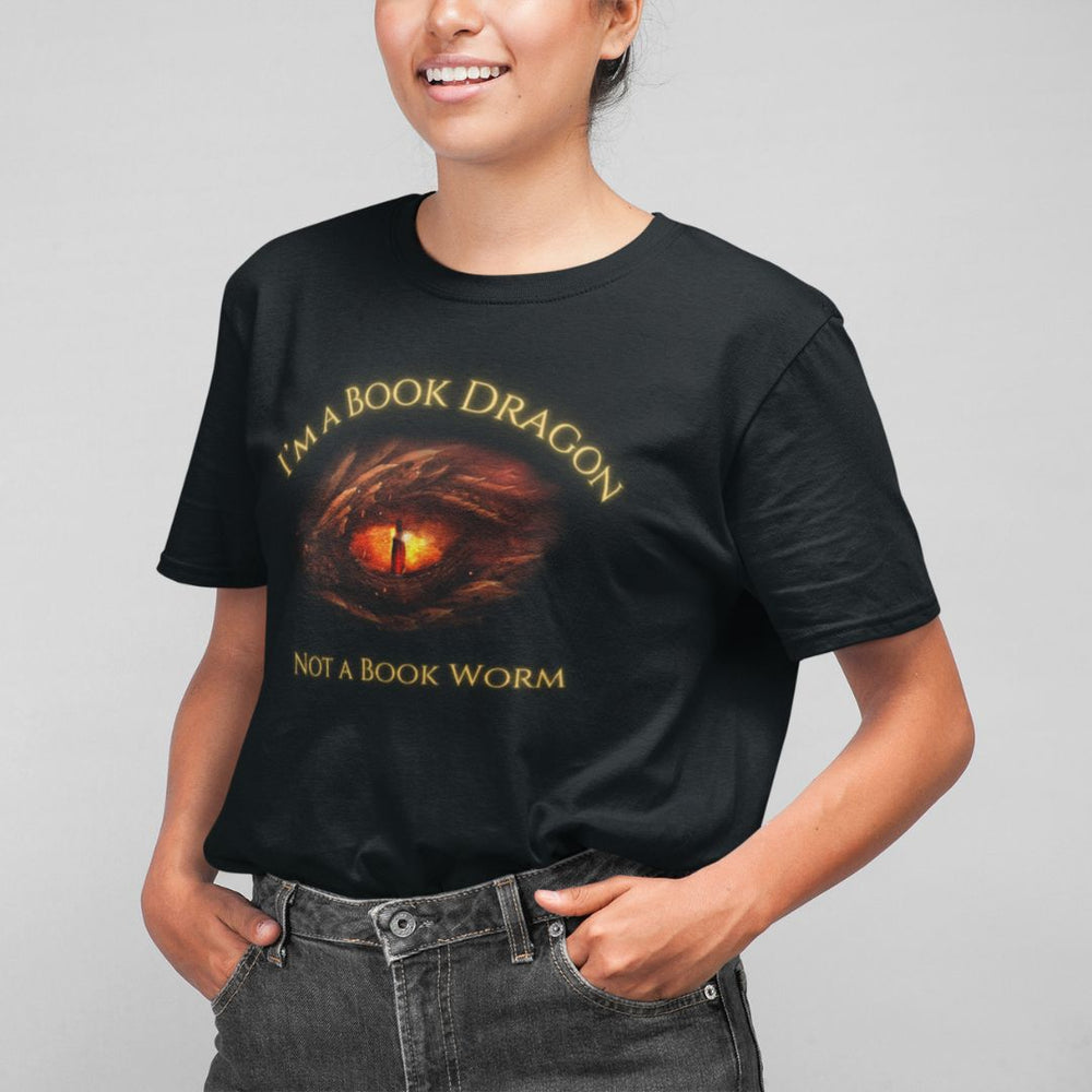 A woman wearing a short sleeve black t-shirt. Design on the shirt reads "I'm a book dragon not a book worm." Between the text is the red dragon eye from the cover of Firesight.