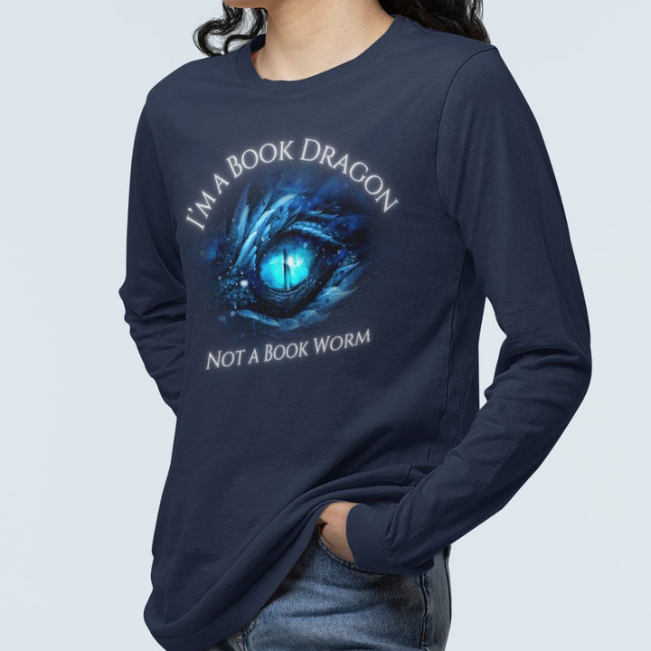 A woman wearing a long sleeve navy t-shirt. Design on the shirt reads "I'm a book dragon not a book worm." Between the text is the blue dragon eye from the cover of Frostsight.