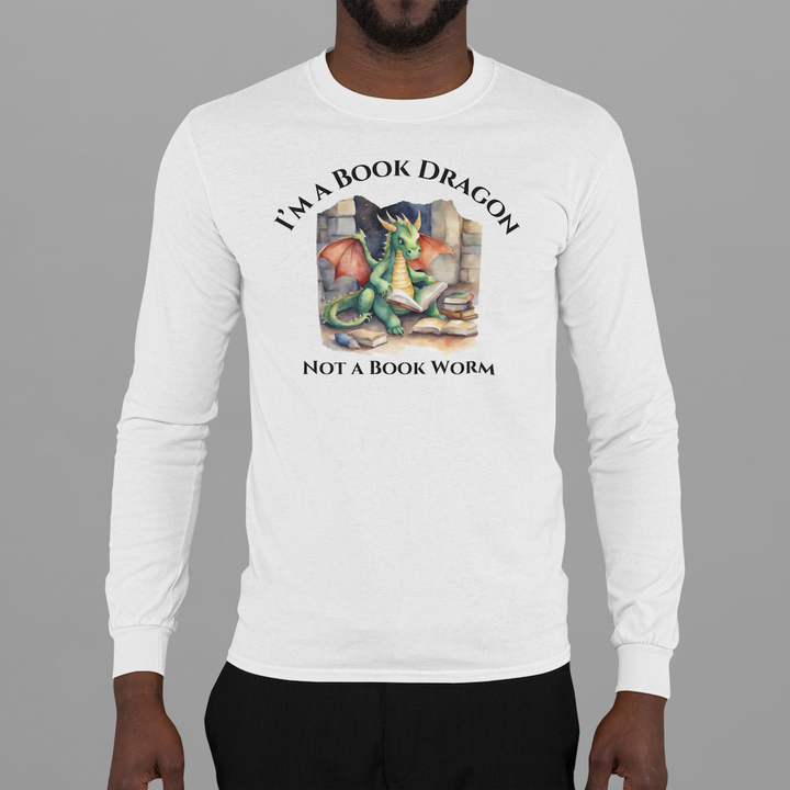 A man wearing a long sleeve heather gray t-shirt. Design on the shirt reads "I'm a book dragon not a book worm." Between the text is a watercolor design of a dragon reading next to a stack of books.