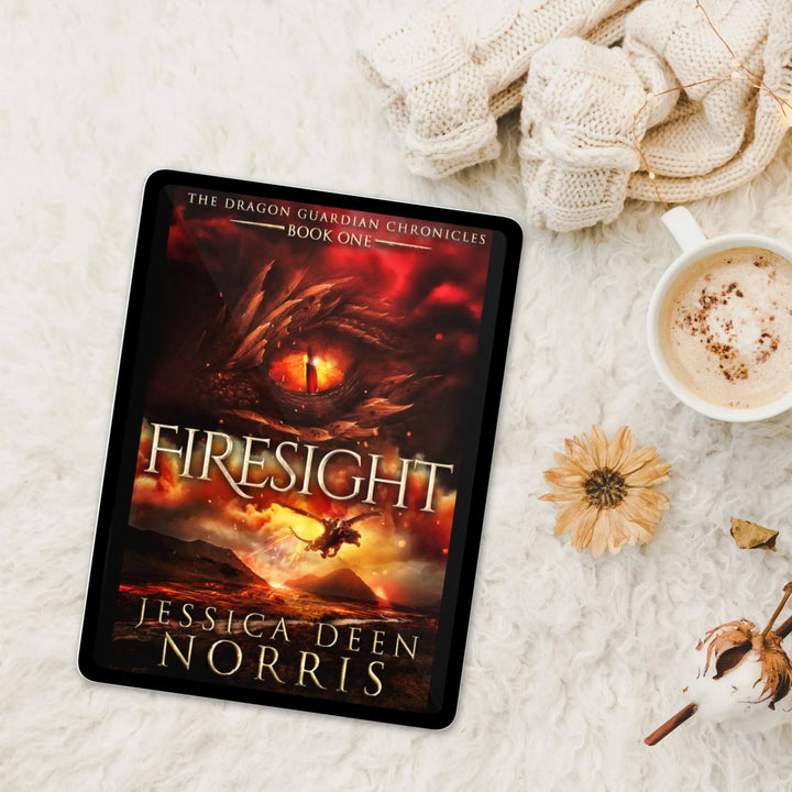 Firesight ebook with cover showing on a tablet device. Cover features the title across the middle with a red dragon eye and "The Dragon Guardian Chronicles Book 1" above it. Below the title, the two main characters ride on a dragon over a volcano erupting. The author's name is at the bottom of the cover.