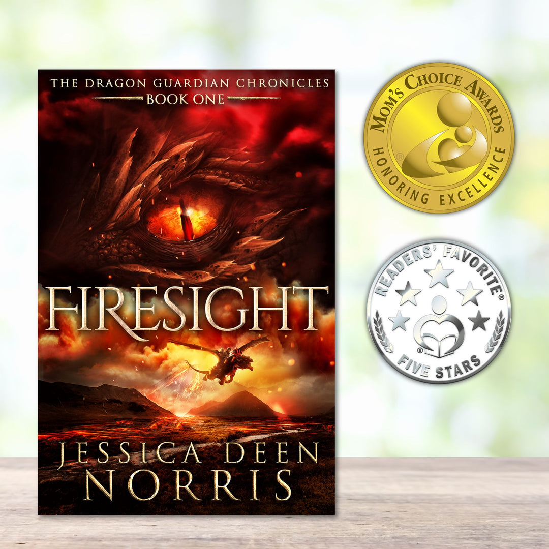 Firesight book cover next to two award medals - Mom's Choice Award and Readers' Favorite Five Stars Review. Cover features the title across the middle with a red dragon eye and "The Dragon Guardian Chronicles Book 1" above it. Below the title, the two main characters ride on a dragon over a volcano erupting. The author's name is at the bottom of the cover.