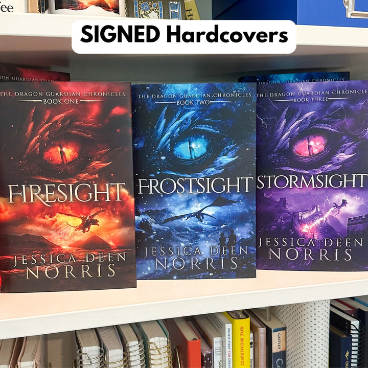 Firesight, Frostsight, and Stormsight hardcovers shown on the bookshelf. These copies are signed by the author.