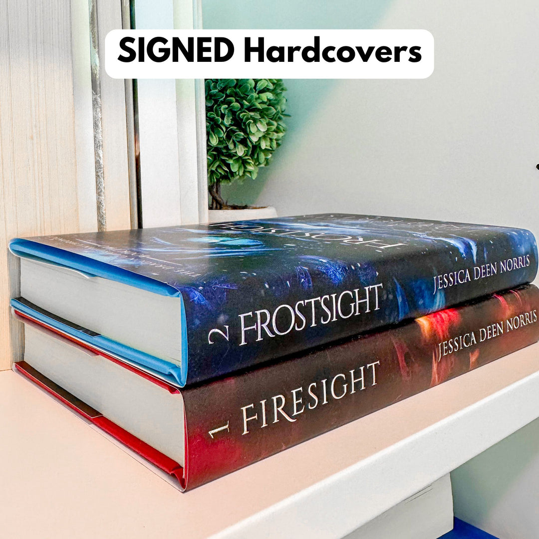 Signed Firesight & Frostsight hardcovers shown stacked on a bookshelf