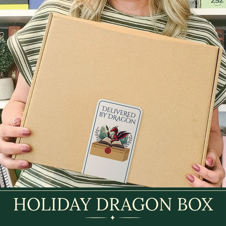 A person holds a large brown cardboard box labeled &