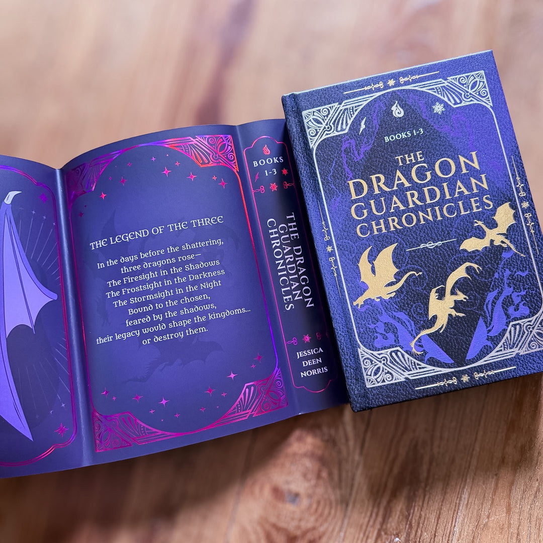 Open book titled 'The Dragon Guardian Chronicles' showing reversible foiled dust jacket