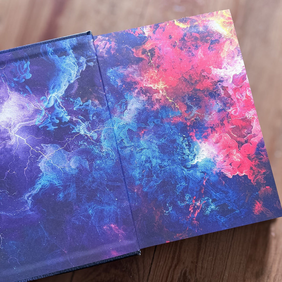 Endpapers with abstract designs on a wooden surface