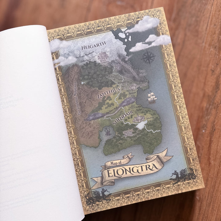Colorful Map of Elongtura inside book with decorative gold border
