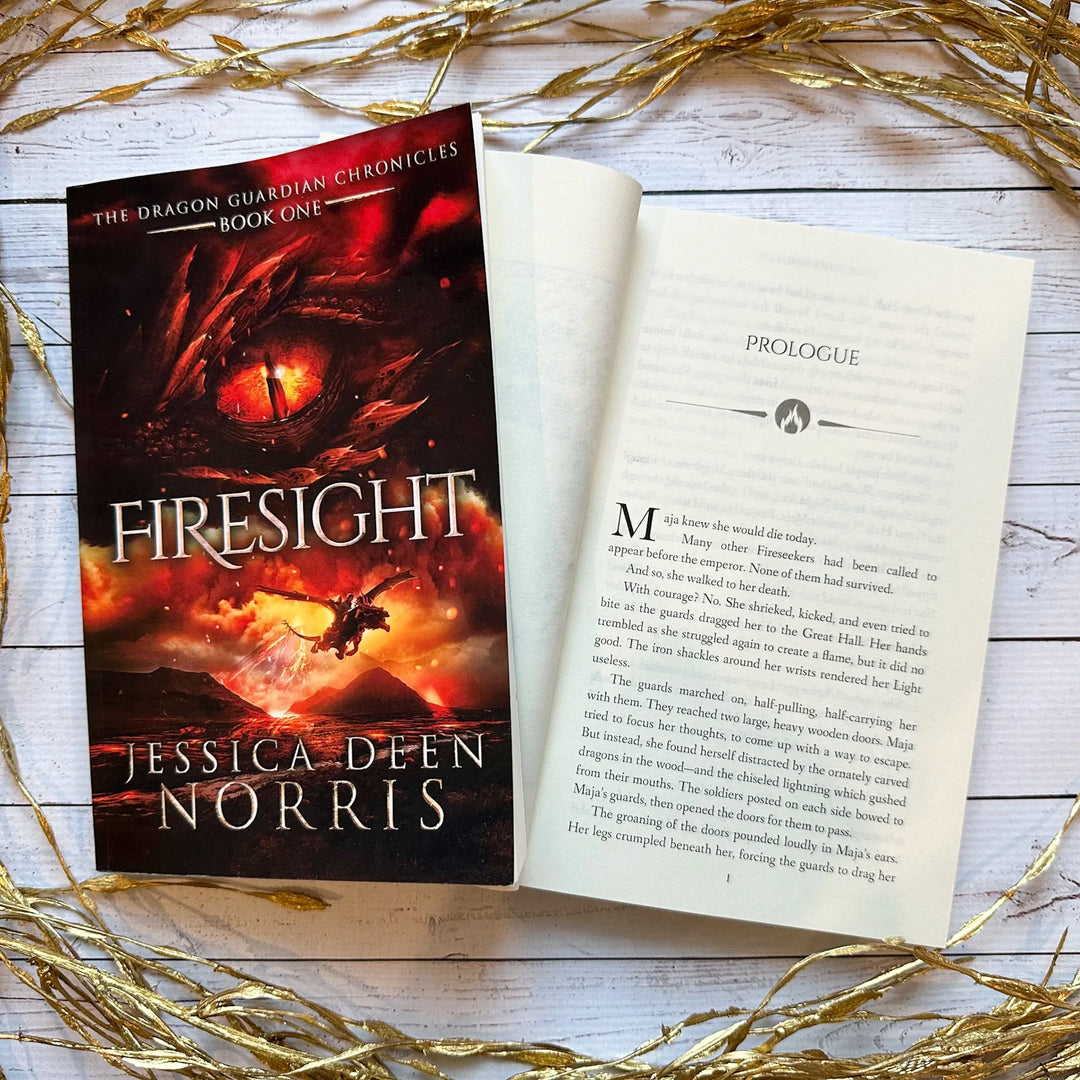 Firesight book cover and another copy open to the first page of the prologue (which can be read on the product page below the image)#autograph-option_signed-by-author