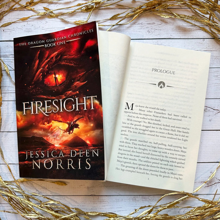 Firesight book cover and another copy open to the first page of the prologue (which can be read on the product page below the image)#autograph-option_signed-by-author