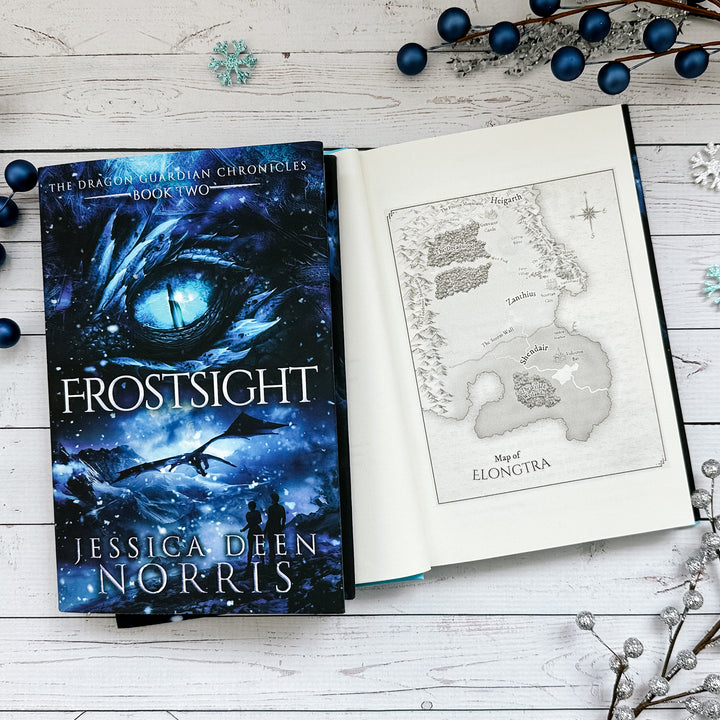 Frostsight book cover and another copy open to the map of Elongtra