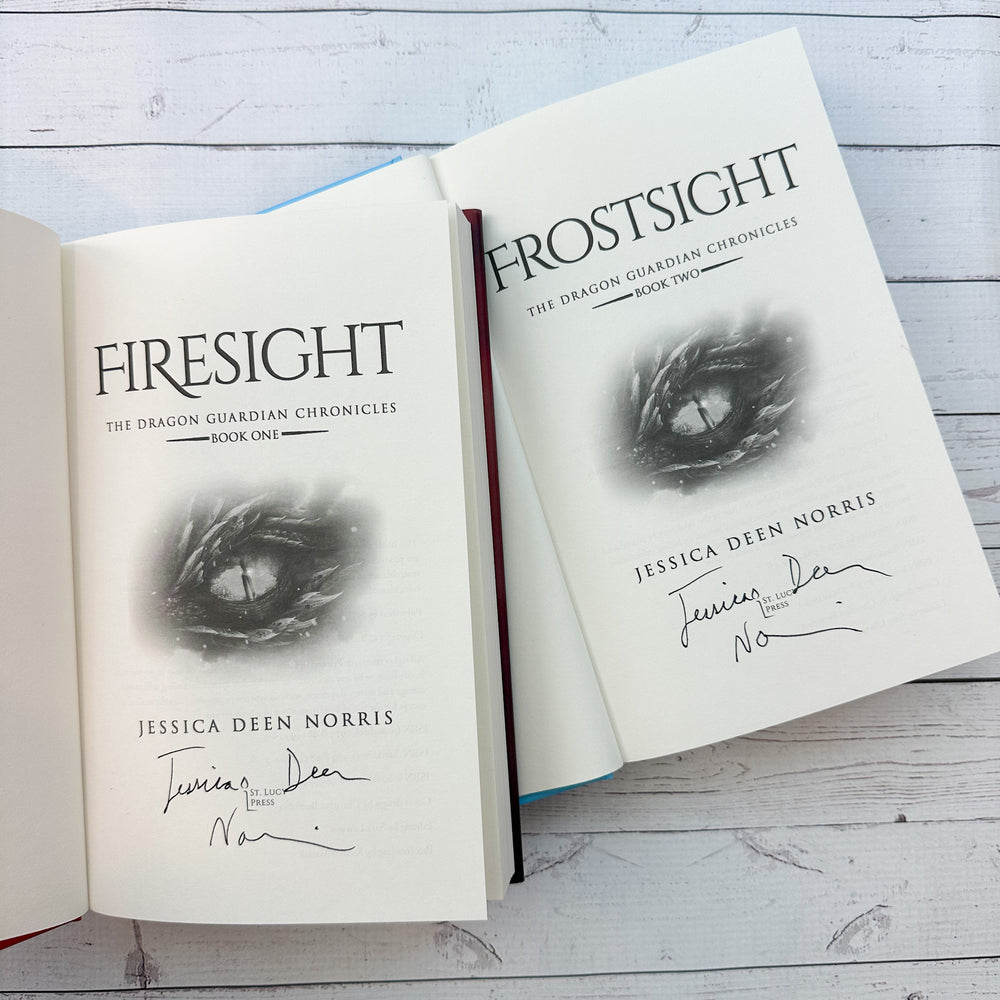 Firesight & Frostsight hardcovers open to title page showing Jessica Deen Norris's signature on both