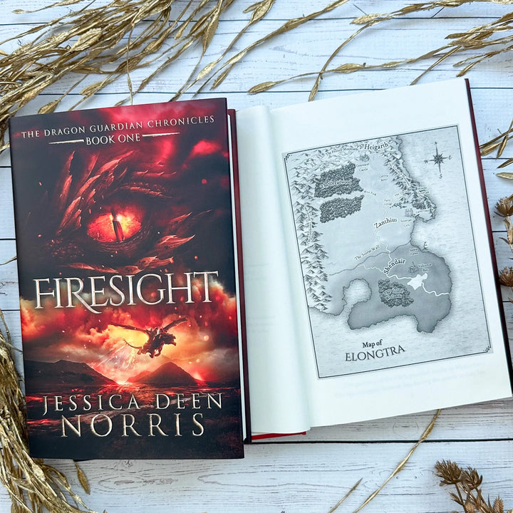 Firesight book cover and another copy open to the map of Elongtra#autograph-option_signed-by-author