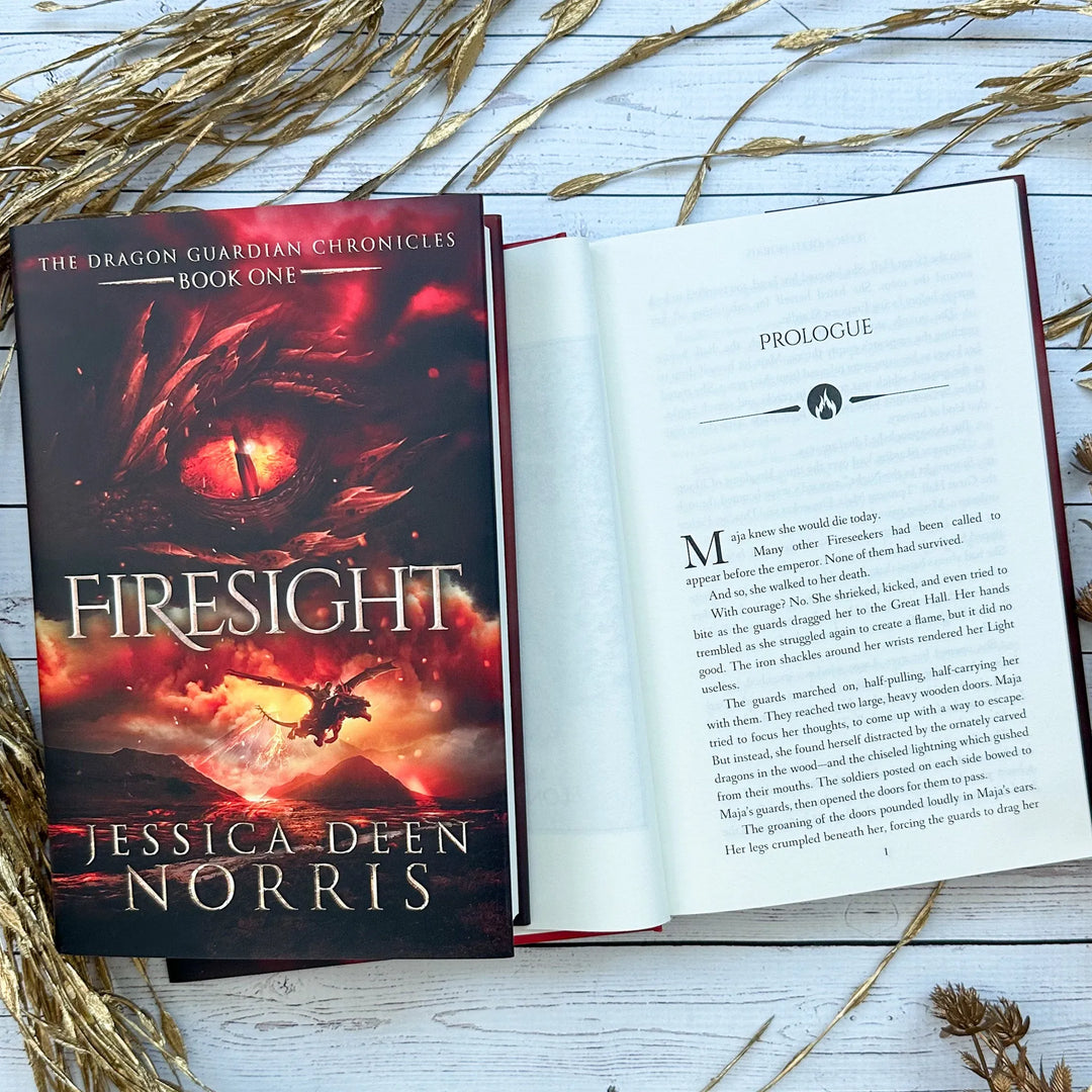 Firesight book cover and another copy open to the first page of the prologue (which can be read on the product page below the image)