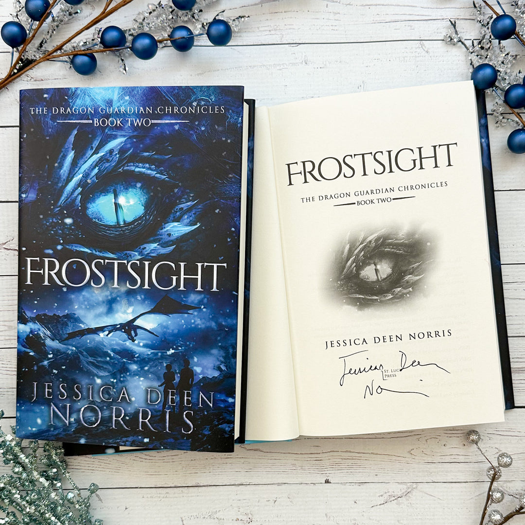 Frostsight book cover and another copy open to the title page with the author's signature#autograph-option_signed-by-author