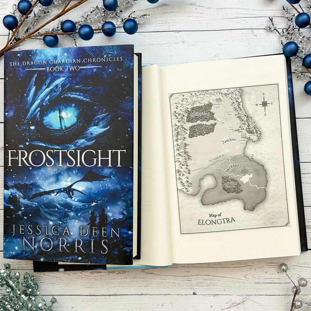 Frostsight book cover and another copy open to the map of Elongtra#autograph-option_signed-by-author