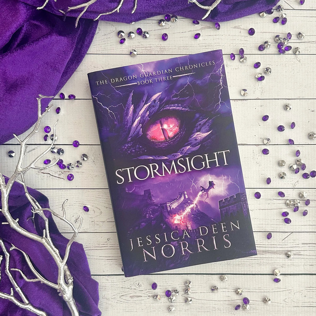 Stormsight hardcover cover. Cover features the title across the middle with a purple dragon eye and "The Dragon Guardian Chronicles Book 3" above it. Below the title, a dragon breathes lightning onto a huge stone wall. The author's name is at the bottom of the cover.#autograph-option_unsigned