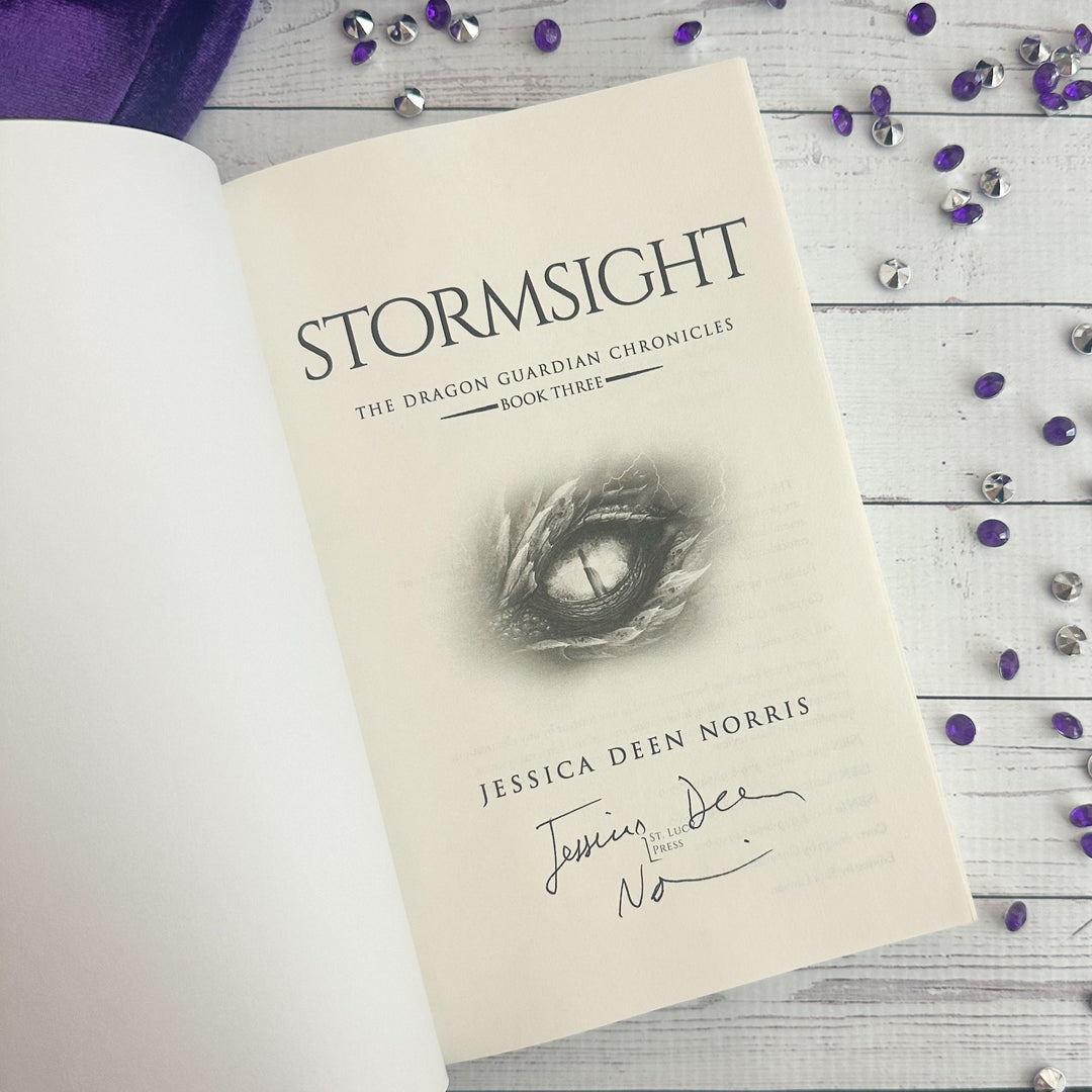 Stormsight open to the title page with the author's signature#autograph-option_signed-by-author