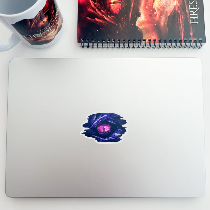 Stormsight dragon eye sticker on a laptop