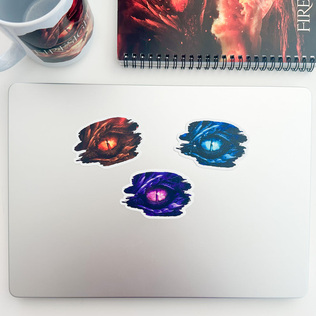 Firesight, Frostsight, and Stormsight dragon eye stickers on a laptop