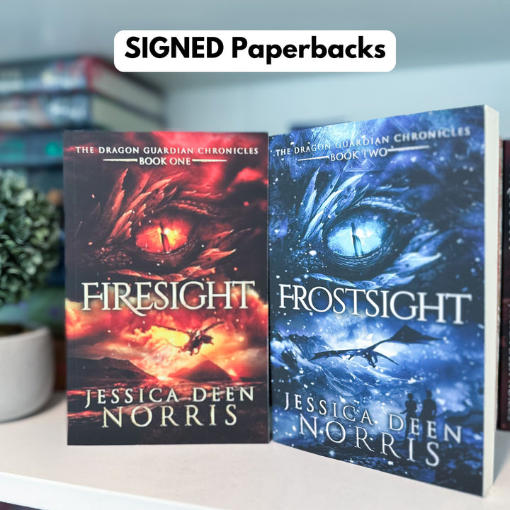 Signed Firesight & Frostsight paperbacks shown on a bookshelf