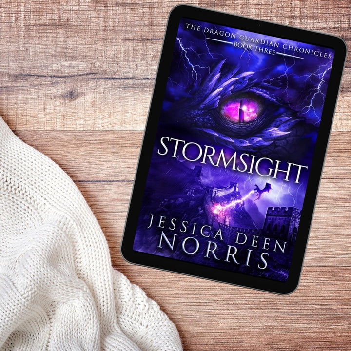 Stormsight ebook with cover showing on a tablet device. Cover features the title across the middle with a purple dragon eye and "The Dragon Guardian Chronicles Book 3" above it. Below the title, a dragon breathes lightning onto a huge stone wall. The author's name is at the bottom of the cover.