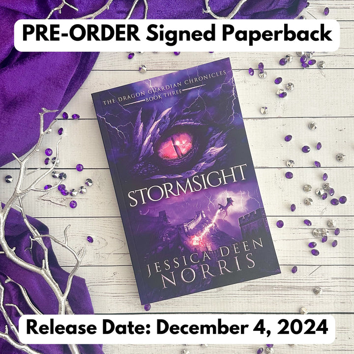 Stormsight paperback cover. Cover features the title across the middle with a purple dragon eye and "The Dragon Guardian Chronicles Book 3" above it. Below the title, a dragon breathes lightning onto a huge stone wall. The author's name is at the bottom of the cover.