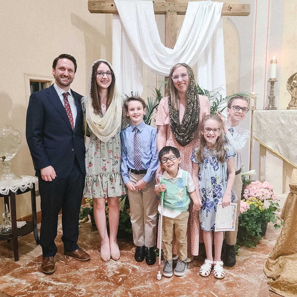 Easter Family Picture - The author Jessica Deen Norris and her family are inside a church. She and her husband and five children smile for a picture.